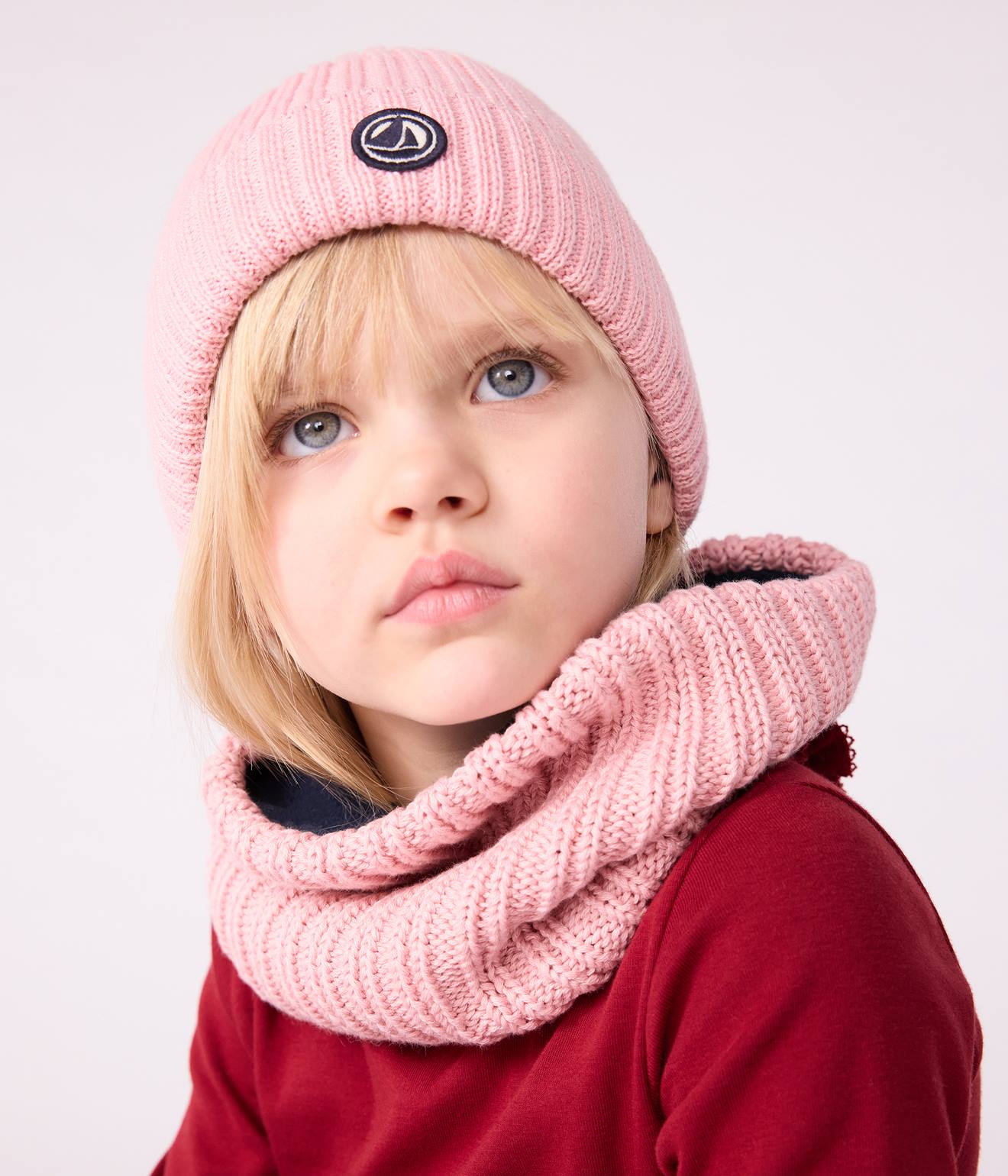 Bonnet enfant en tricot doublé polaire rose